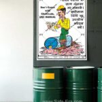 Safe-Era chemical Safety poster CSP-10, mockup image - a worker wearing yellow helmet reading the manual instruction paper, because he stepped into leaking drum chemical which is kept besides the worker. slogan written in both English & Hindi language. English slogans - “Don't guess with the chemicals, use manual”.