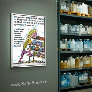 Safe-Era Chemical Skin Contact First Aid Poster CSP-4 in a storage warehouse in a wall, illustrating a worker is trying to take of the chemical barrel from the rack, slogan written in Hindi & English which says - in case of skin contact with hazardous chemicals, immediately wash with water for 15 minutes & notify your supervisor.