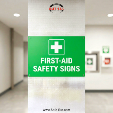 Safe-Era First-Aid Safety Signs category link. Green signboard with a medical cross symbol in a clean facility.