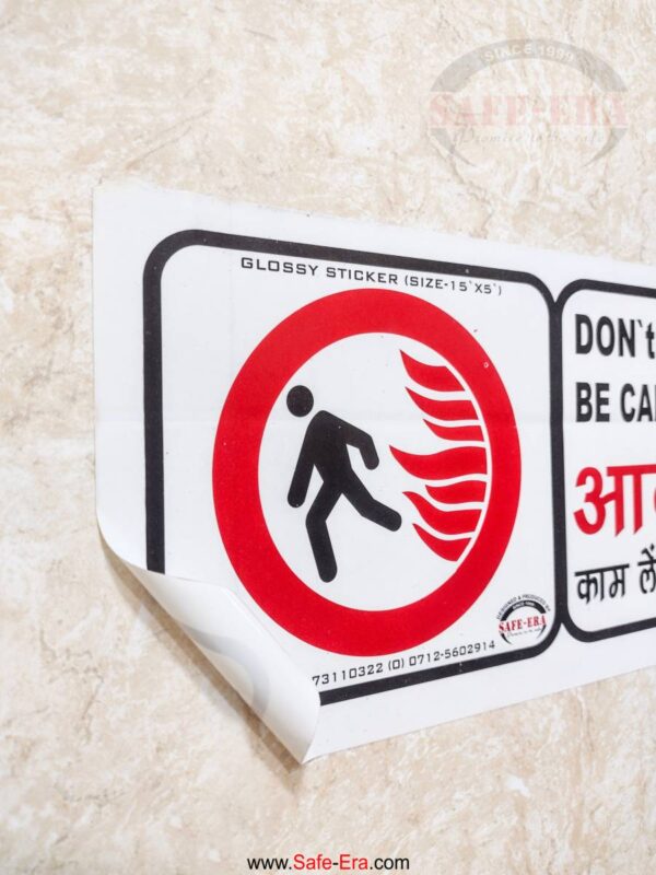 Peel-out view of industrial adhesive safety sticker sheet.